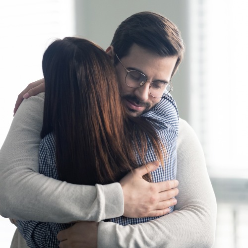 man and woman hugging at remedy therapy at remedy therapy